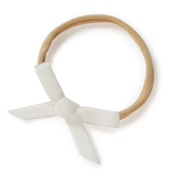 Hair elastic with a white bow on a white background