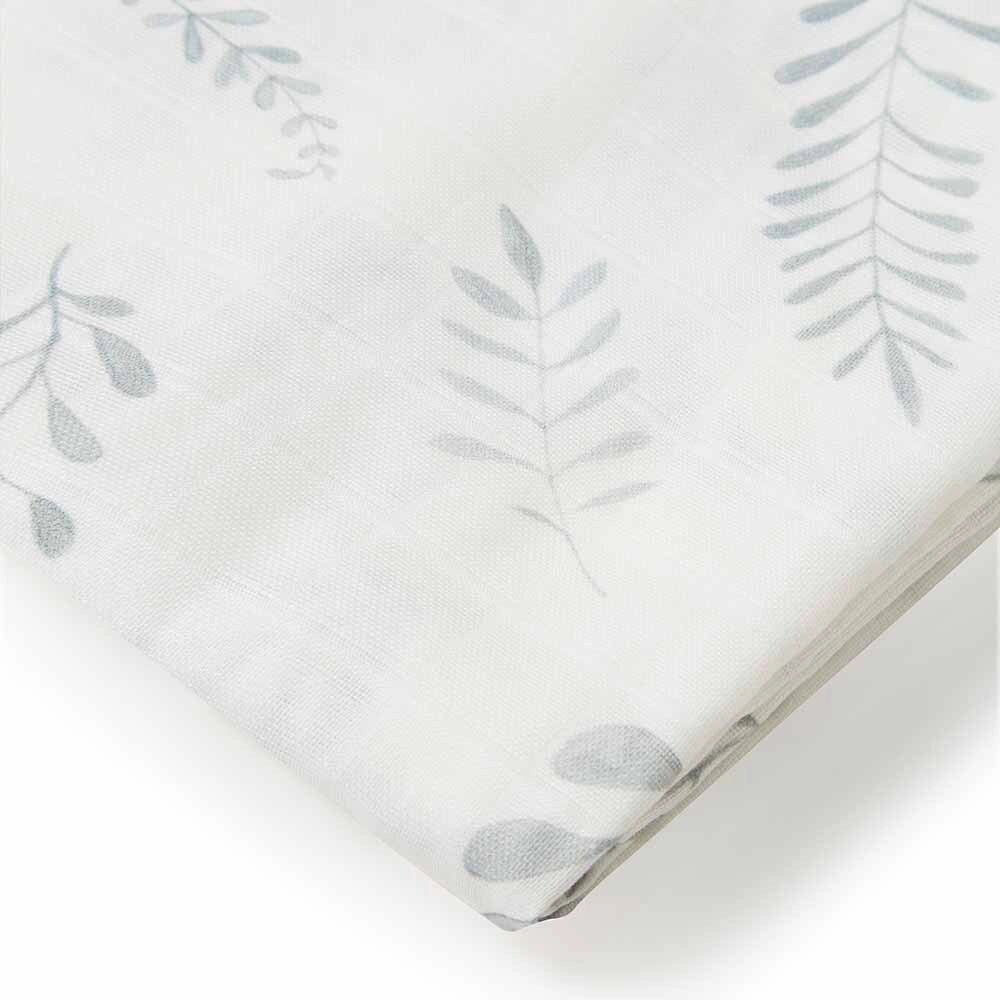 Fitted sheet with subtle leaf pattern on a white background