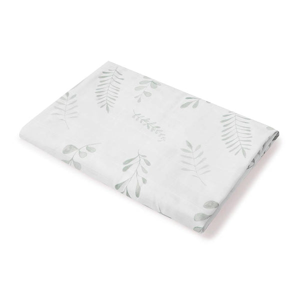 Folded fabric with leaf pattern on a white background
