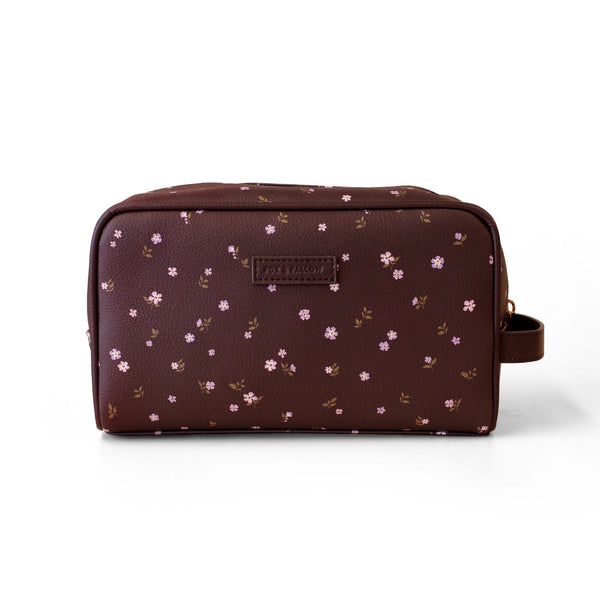 Brown toiletry bag with floral pattern on a white background