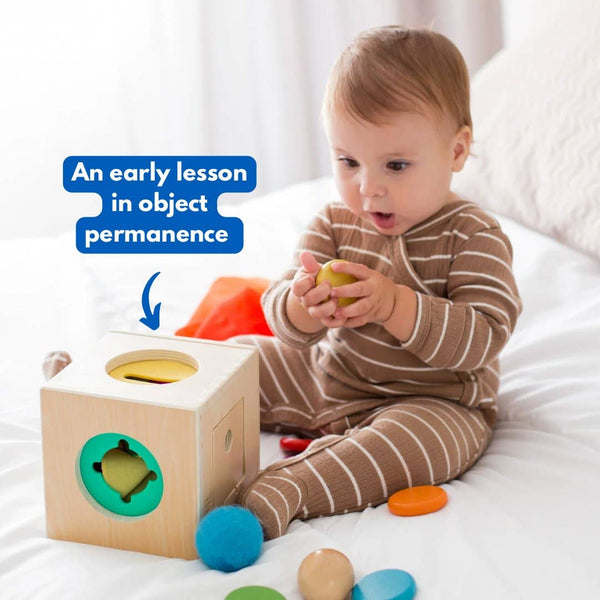 Child playing with a wooden block toy on a bed